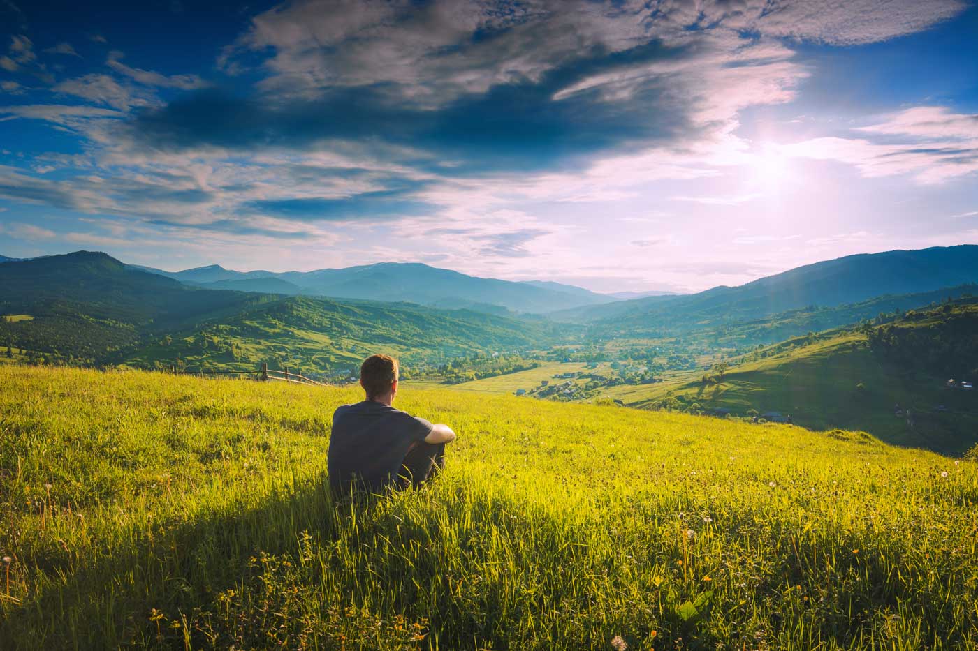 Tourist sitting on a hill